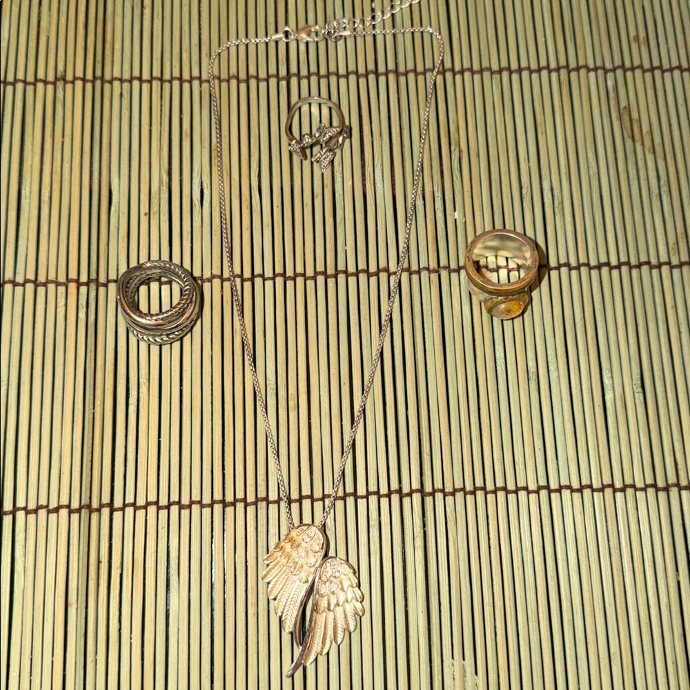 Silver Angel Wing Pendant Necklace and set of 3 rings .